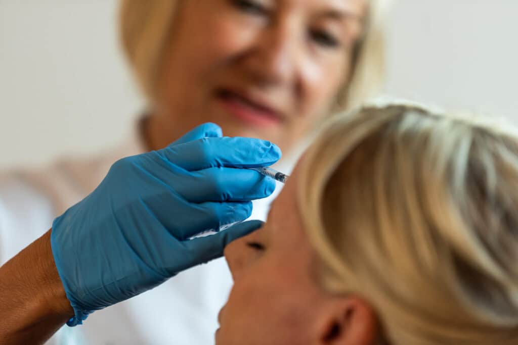 botox being administered in forehead